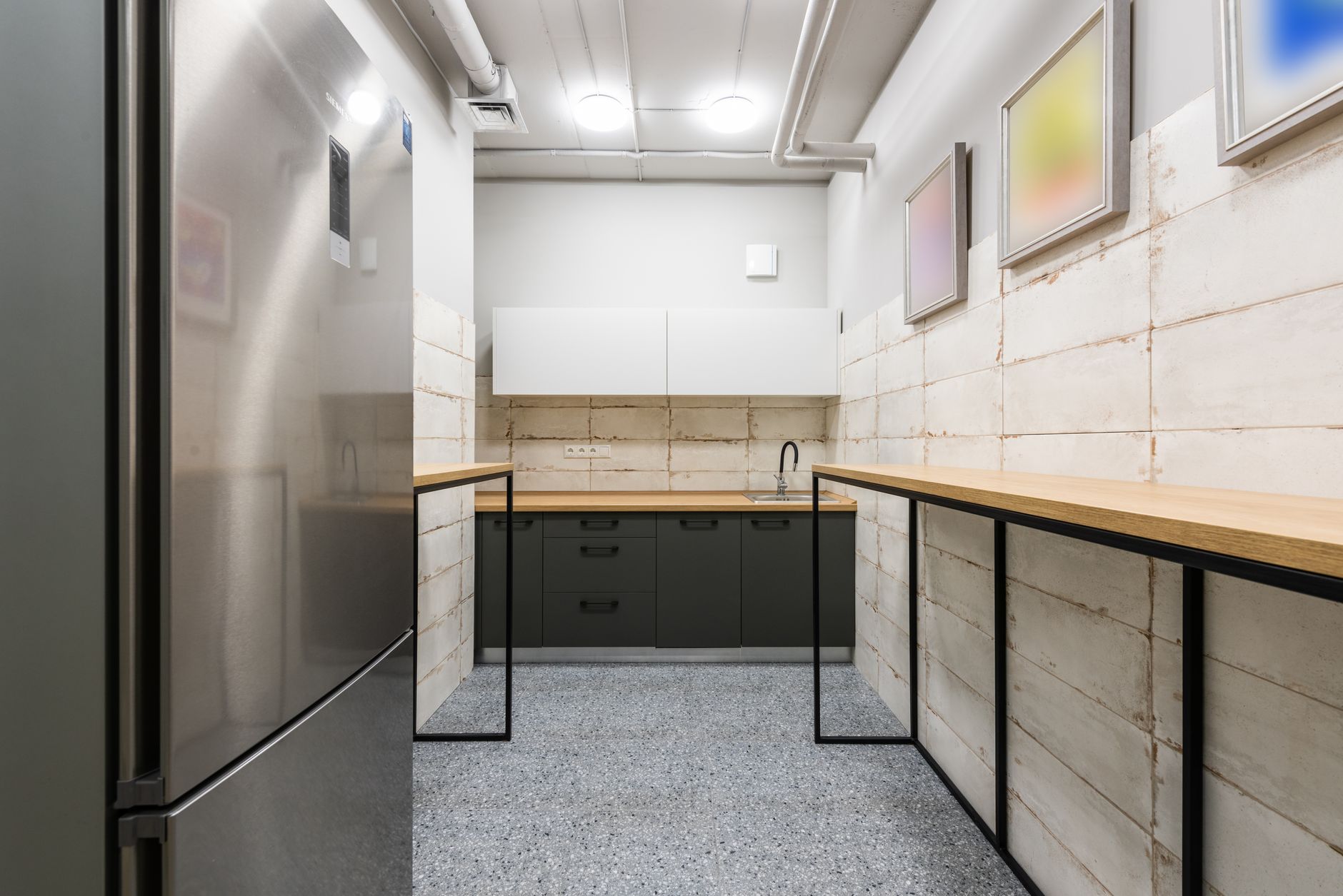 A narrow galley kitchen with counters running down both walls